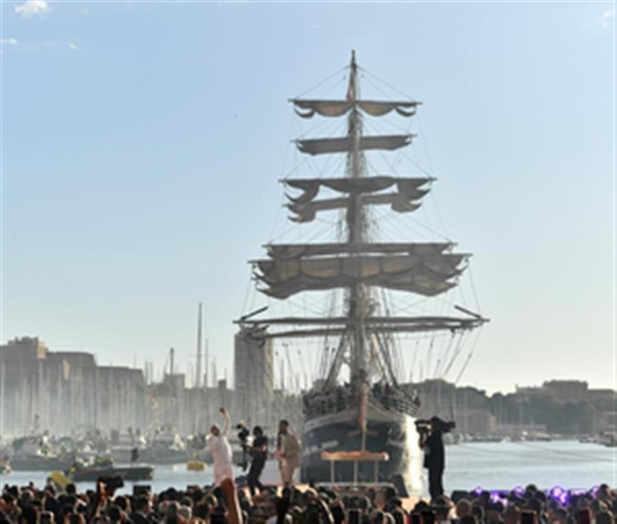 Olympic flame lands at Marseille Old Port amid fiery atmosphere